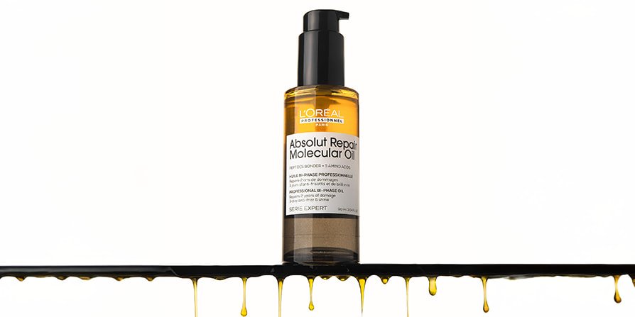 Packshot of a hair repair oil designed to restore damaged hair, leaving lengths stronger, smoother, and visibly healthier with regular use.