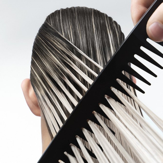 Hair mask for every type of hair applied to long brunette ombré locks to demonstrate deep repair and professional shine.&nbsp;